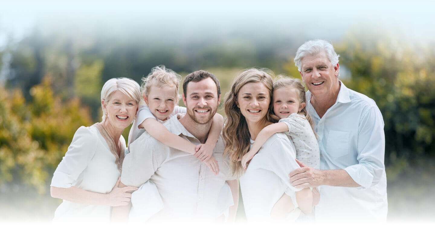 Happy family smiling together outdoors