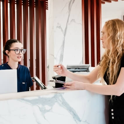 patent talking with staff at front desk