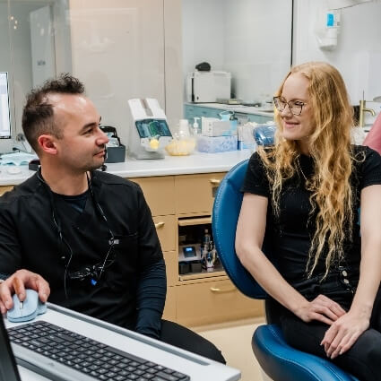 Dimitry talking with Dentist in Hervey Bay patient