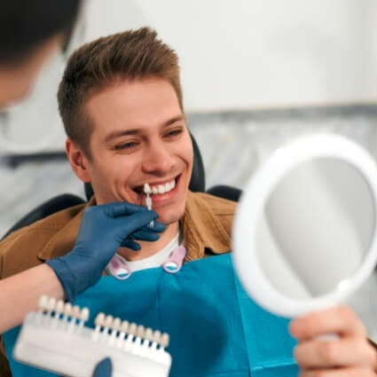 man during a teeth whitening consult