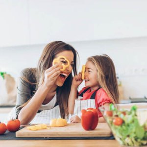 playful mom and daughter