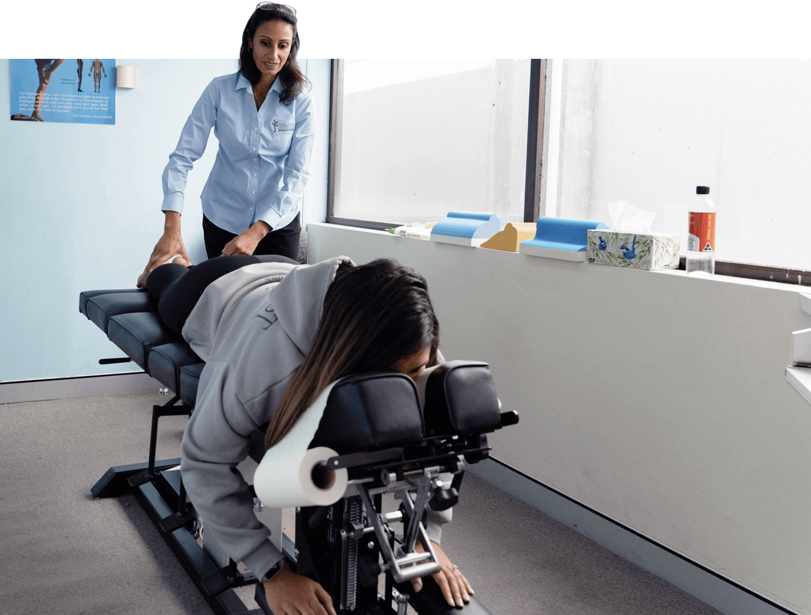 Chiropractor adjusting patient