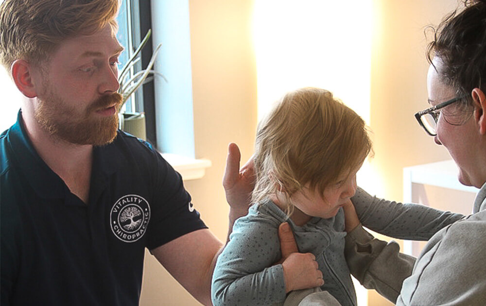 Dr. Caleb treating infant