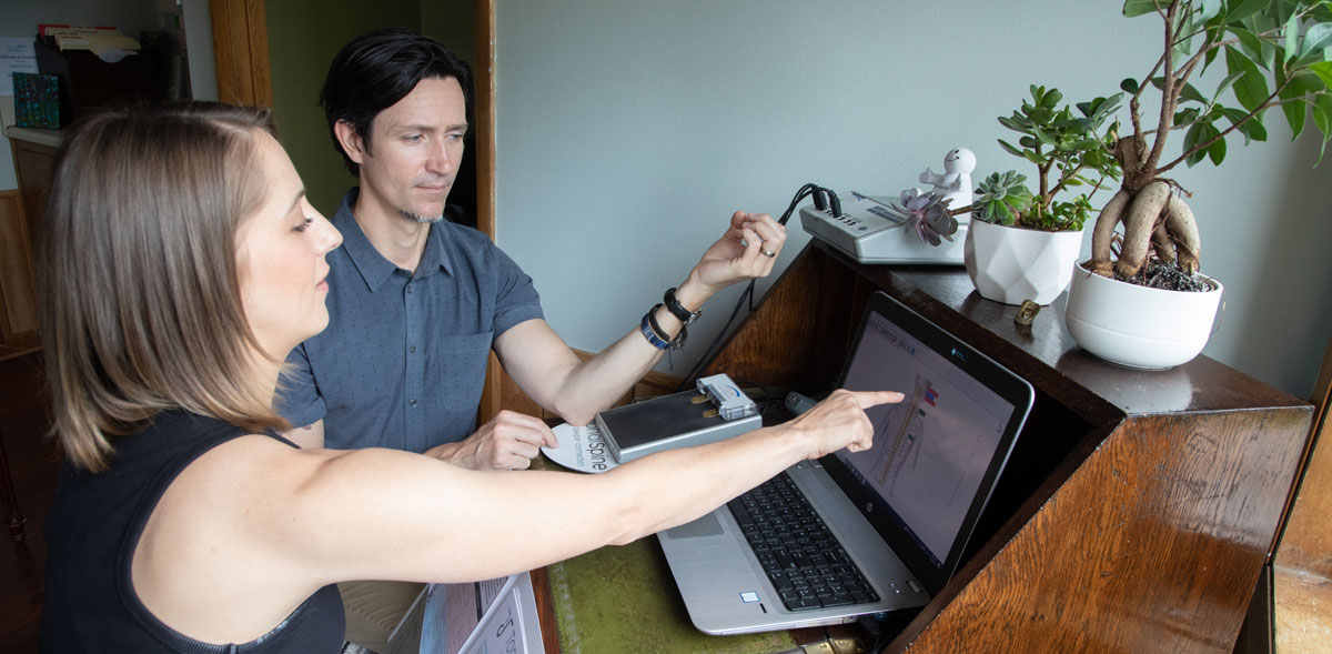 Doctor and patient looking at computer