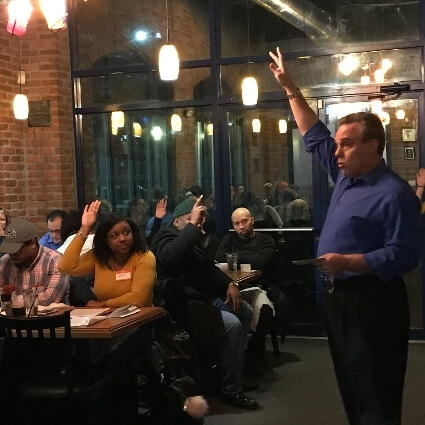 Dr Steve speaking to a room