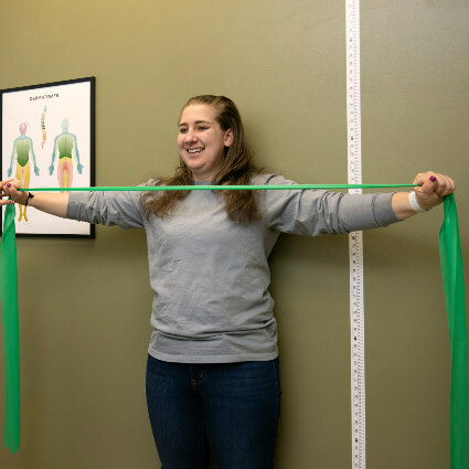 woman holding exercise band