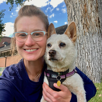 Elizabeth with Goldie infront of a tree