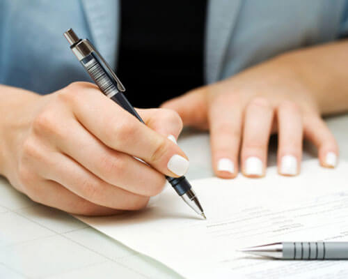 Woman completing paperwork