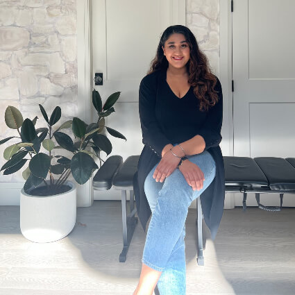 Dr. Manreet Hans sitting on a chair