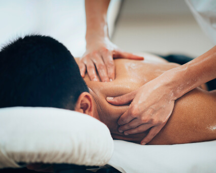 Male patient in massage therapy session