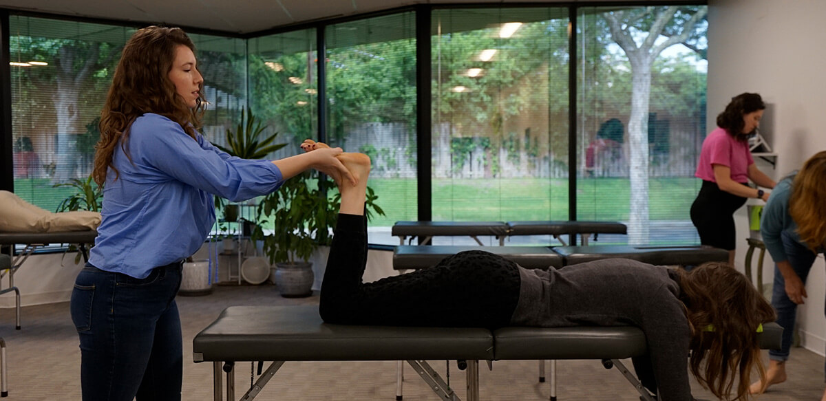 patient having legs adjusted