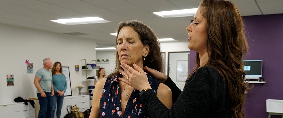 doctor checking patients neck