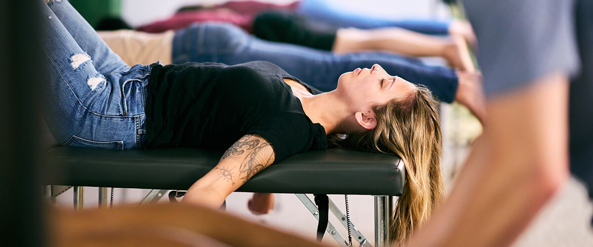 person lying on adjusting table