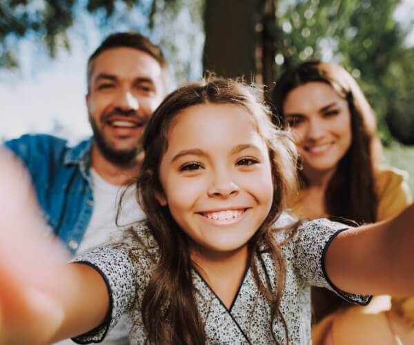 family of three taking picture