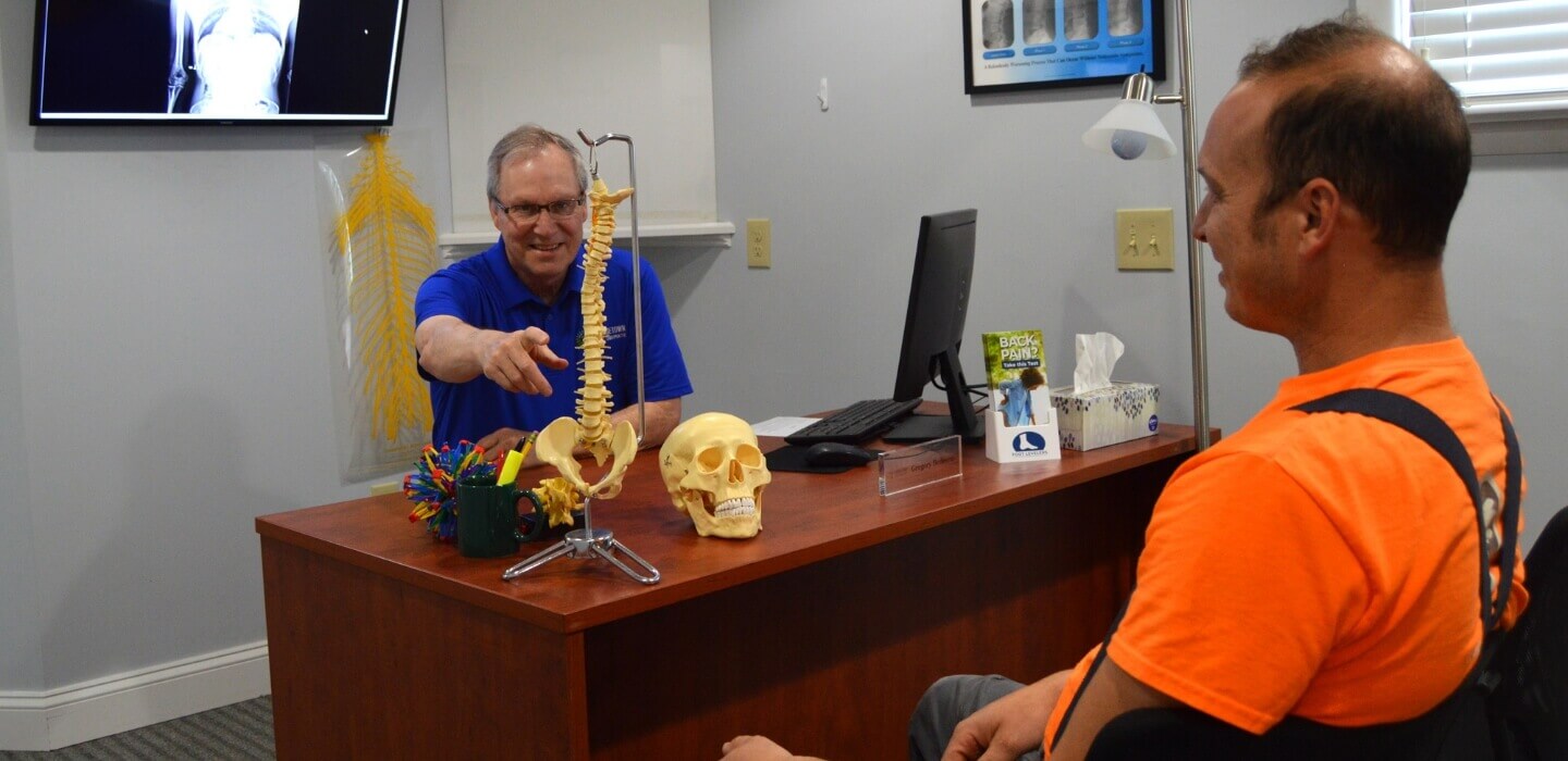 Dr. Gregory talking to patient