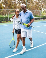 Father and daughter on tennis court