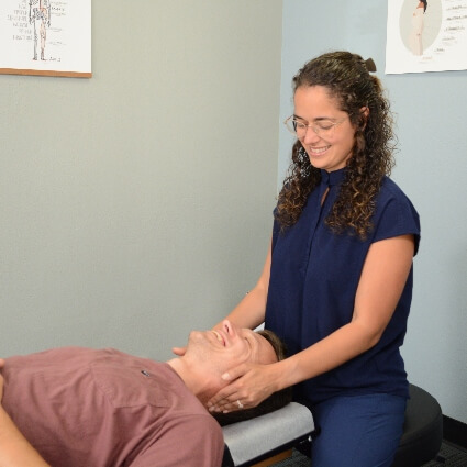 doctor adjusting neck