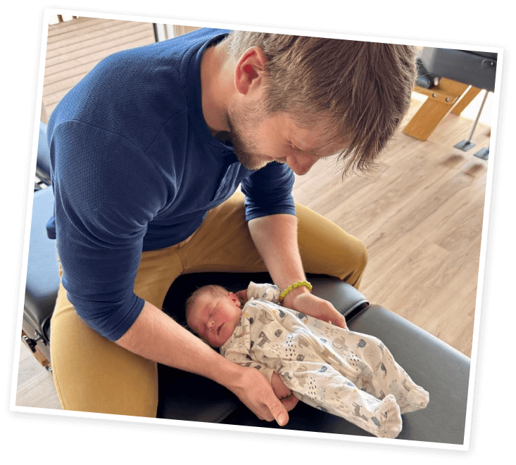 Dr. Harris adjusting tiny baby