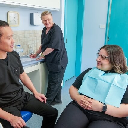 Dentist talking to patient