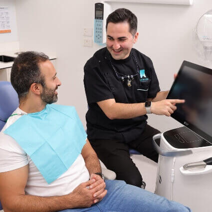 Dr Arik talking with patient