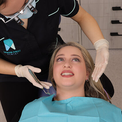patient in chair during dental checkup