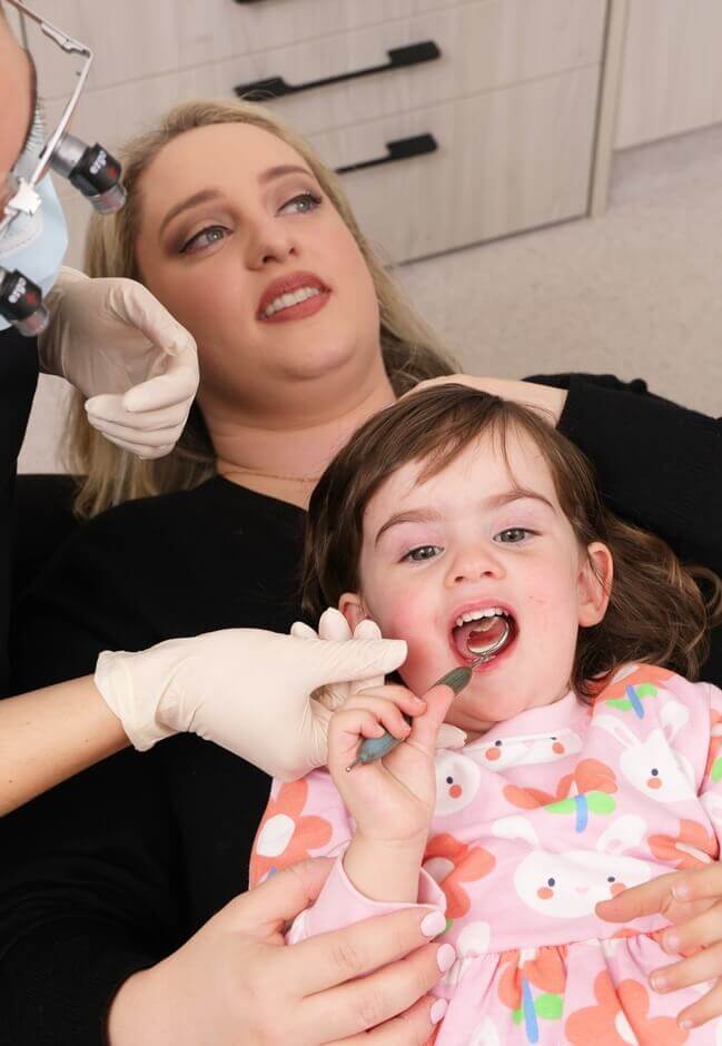 Mother and Daughter at dentist chair
