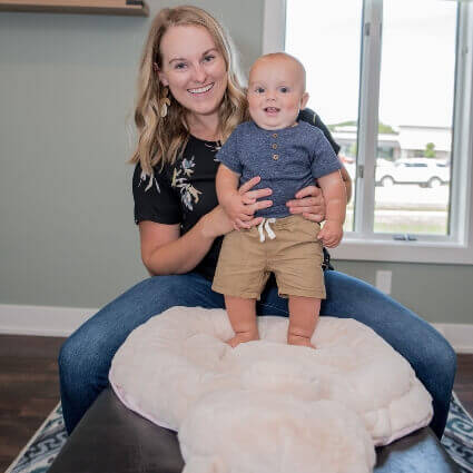 dr. kari with baby standing up