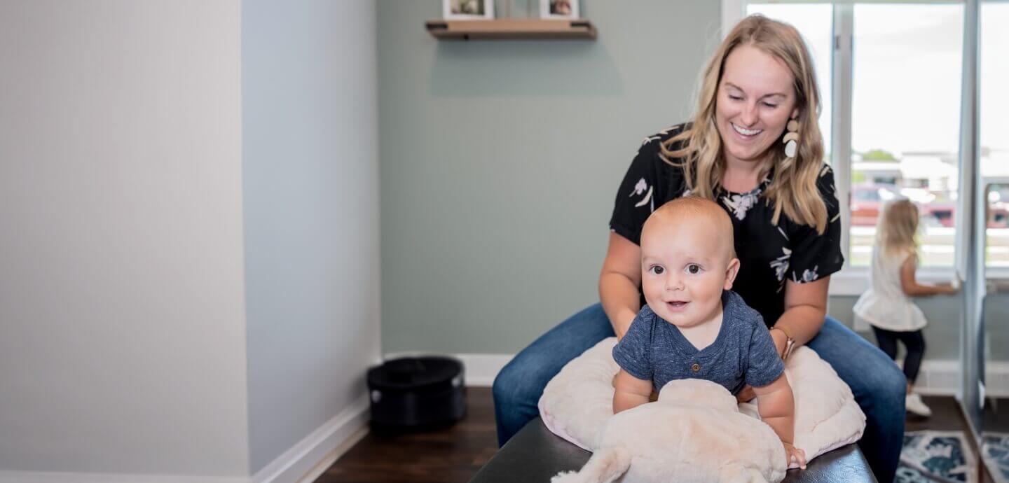 Dr. Kari adjusting toddler