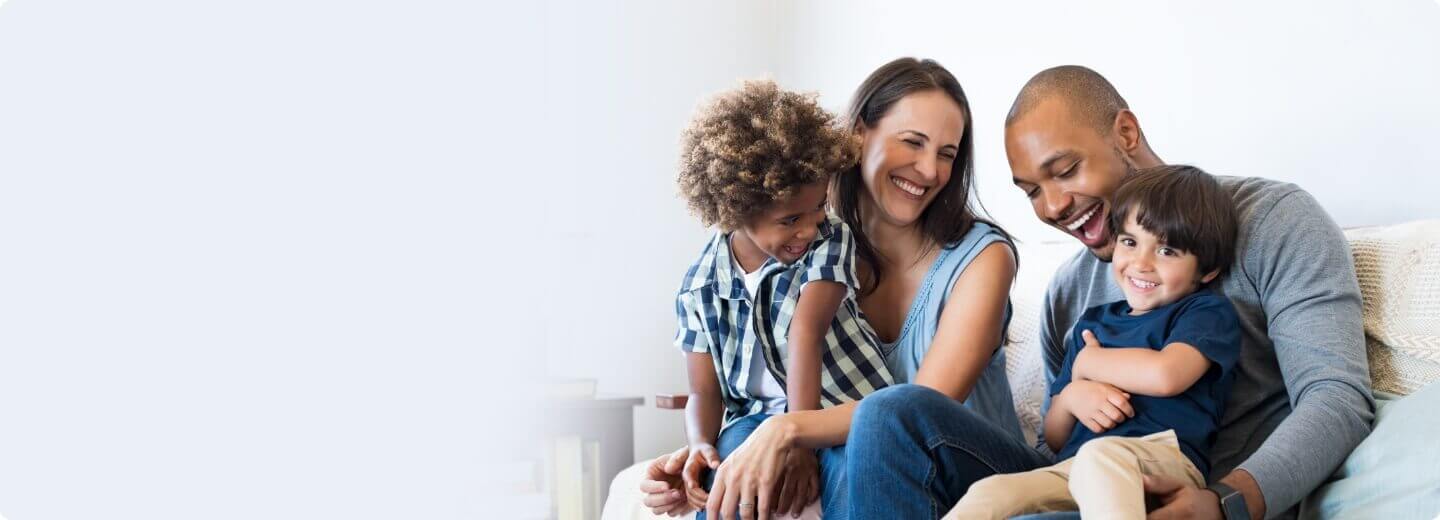 Happy family sitting on a couch