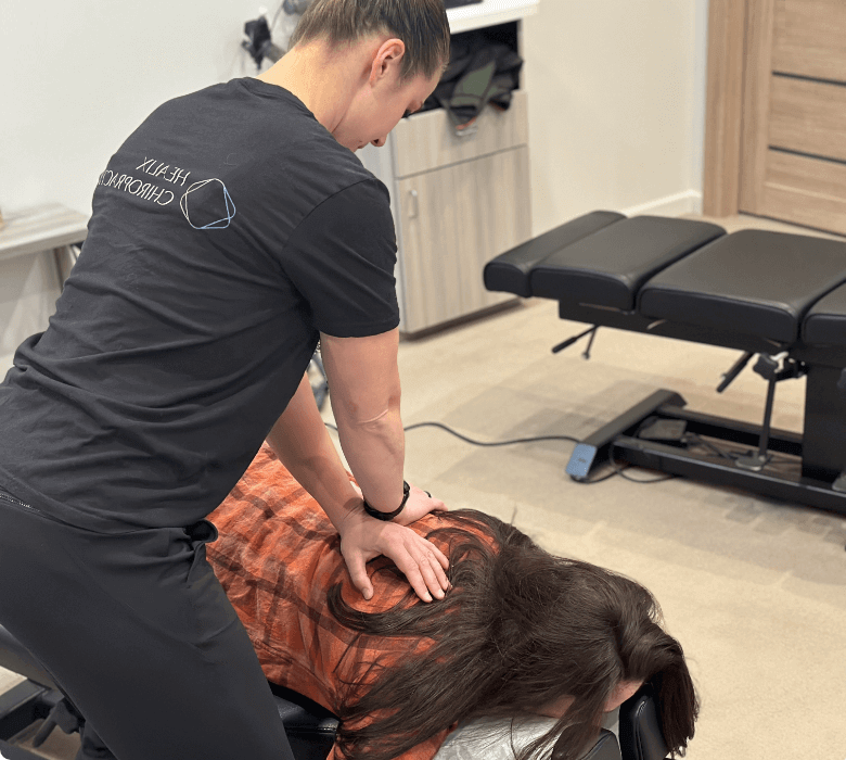 Female patient upper-back adjustment