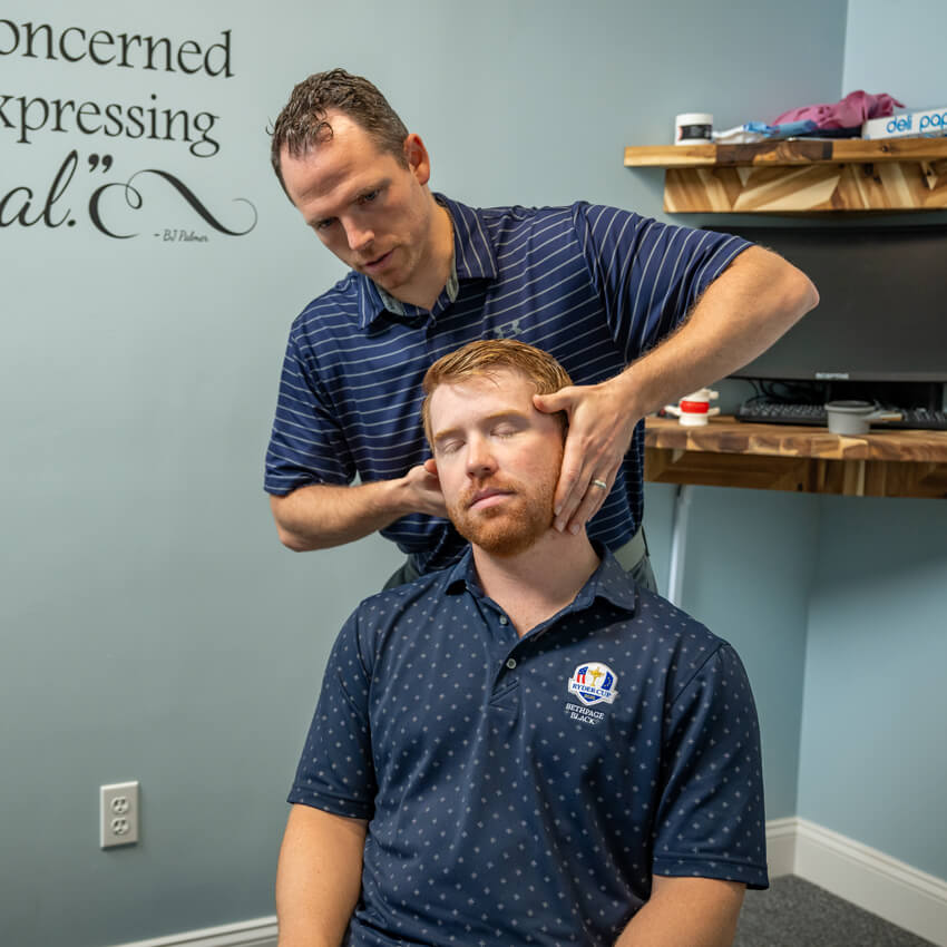 adjusting man's neck