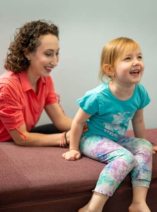 chiropractor checking child patient