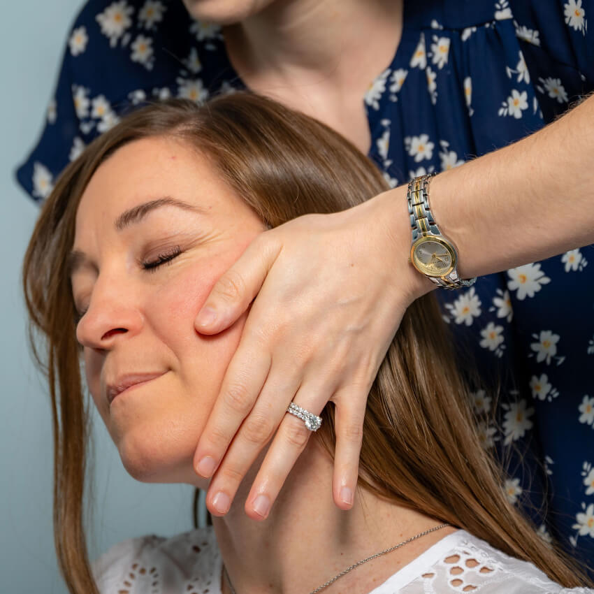 woman getting neck adjustment