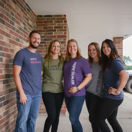 Dr. Ryan and team outside of building