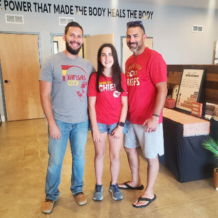 Doctor and patients wearing Kansas City chiefs shirts