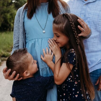 Pregnant woman with family