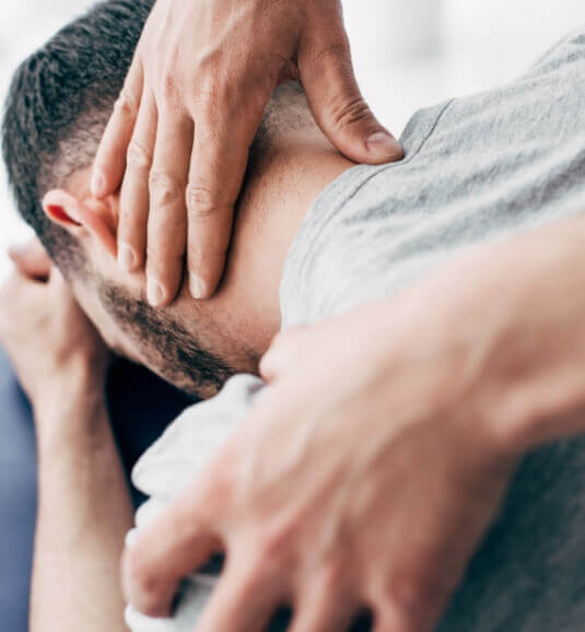 Neck massage on male patient