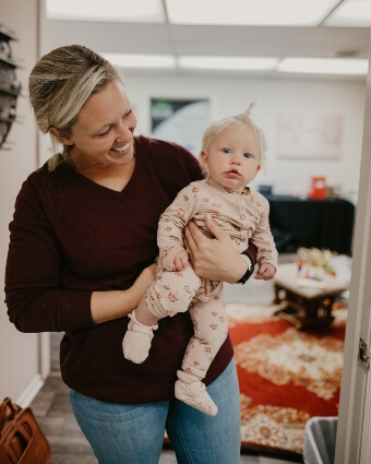 Female holding a happy baby