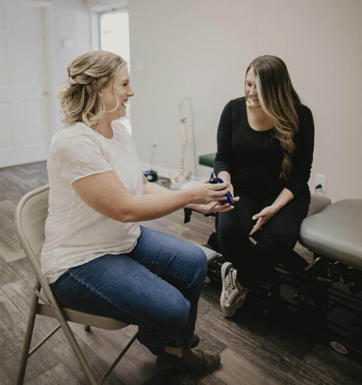 Dr. Leslie interacting with a female patient