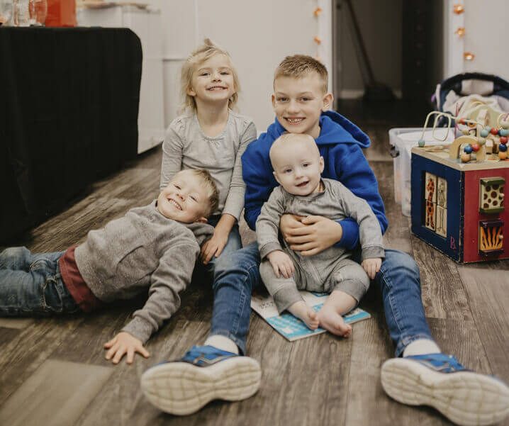 Smiling children sitting on the floor