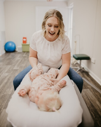 Dr. Leslie interacting with pediatric patient