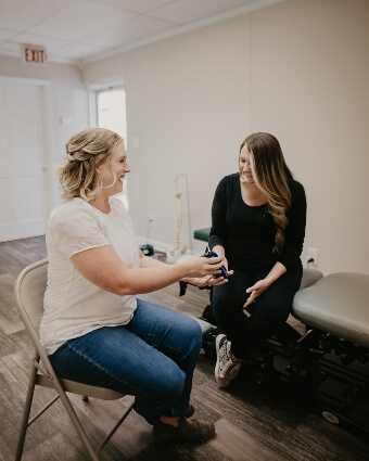 Dr. Leslie talking to a female patient