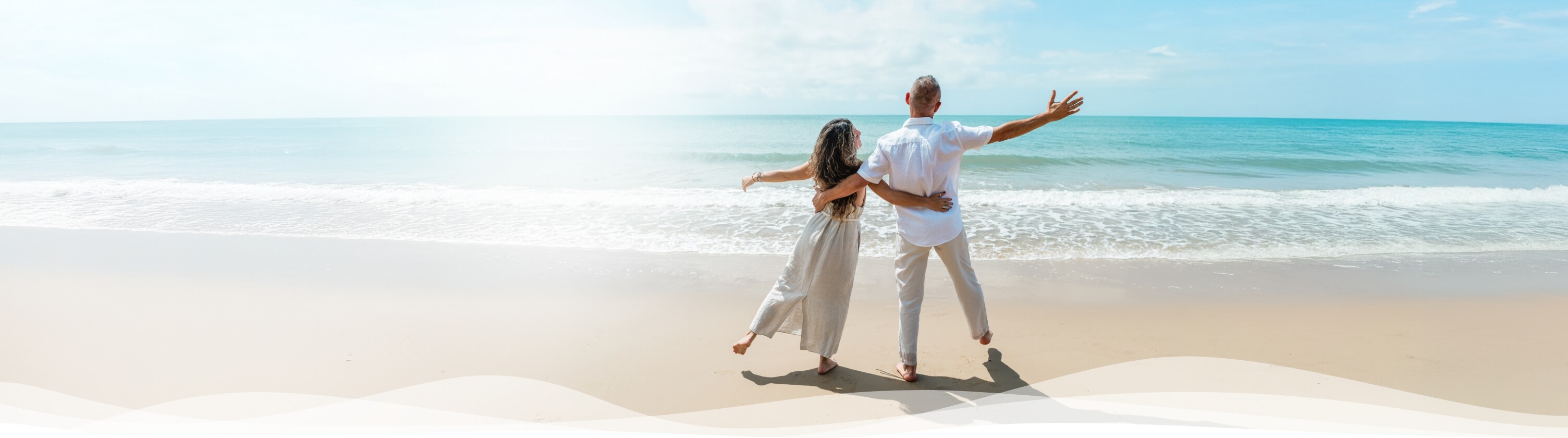 family walking on sunny beach