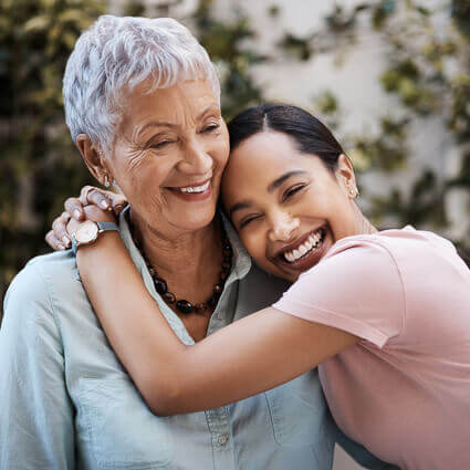 hugging grandmother and grand daugther