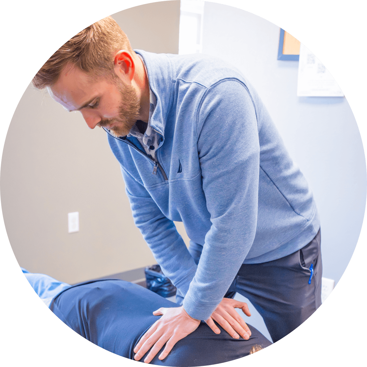 Chiropractor adjusting patient