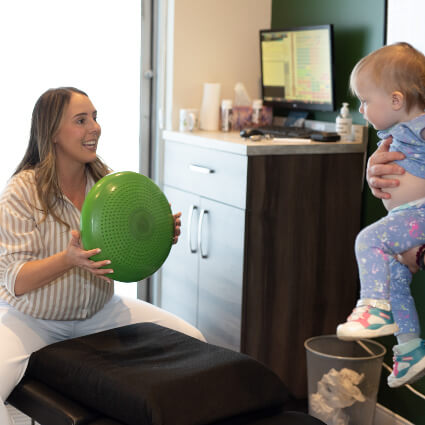 Dr Hansen holding a ball