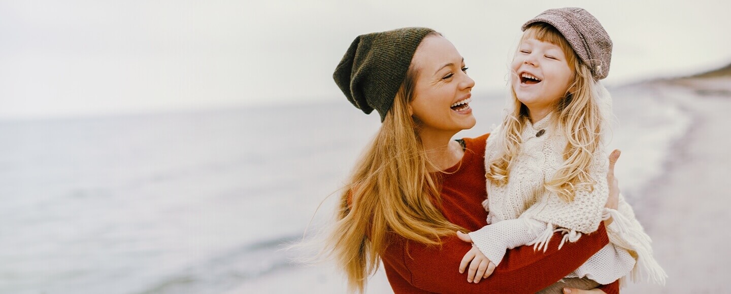 mom and daughter laughing