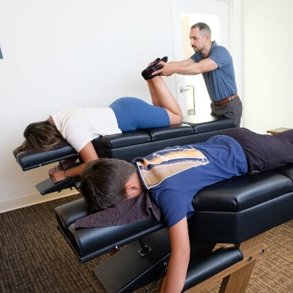 Dr Nick adjusting patients legs