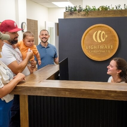 Patients checking in at front desk