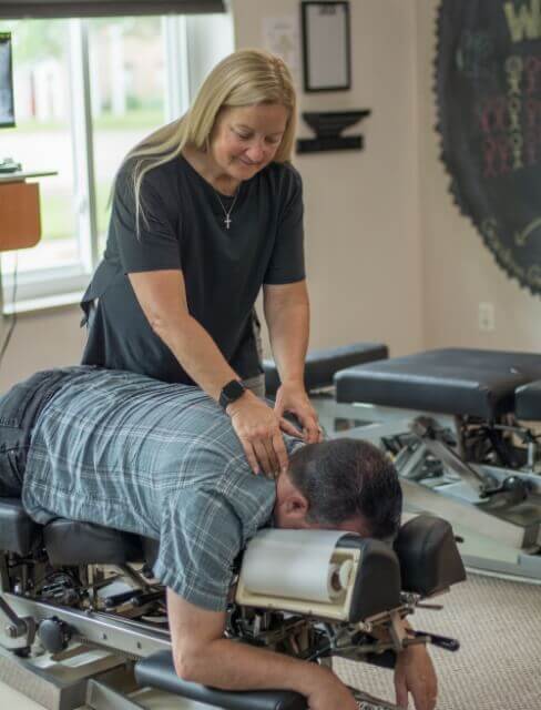 Chiropractor adjusting patient